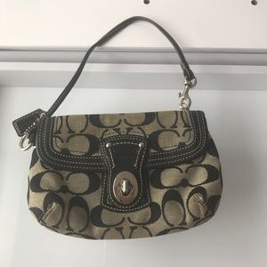Pre-own Small Black & Tan Canvas Coach Wristlet.